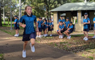 Student from St Aloysius Cronulla running cross country